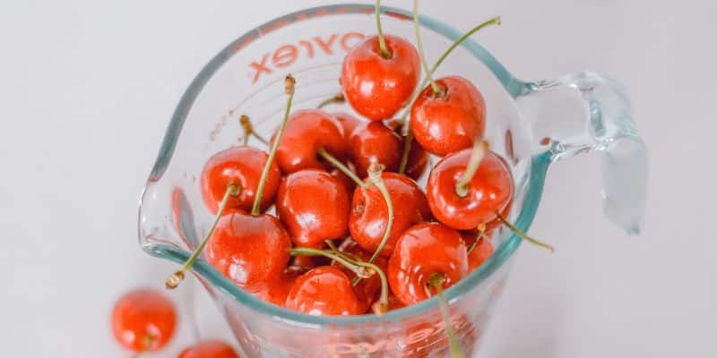 pyrex measuring jug with cherries in