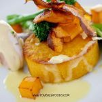butternut squash disk with other vegetables on top