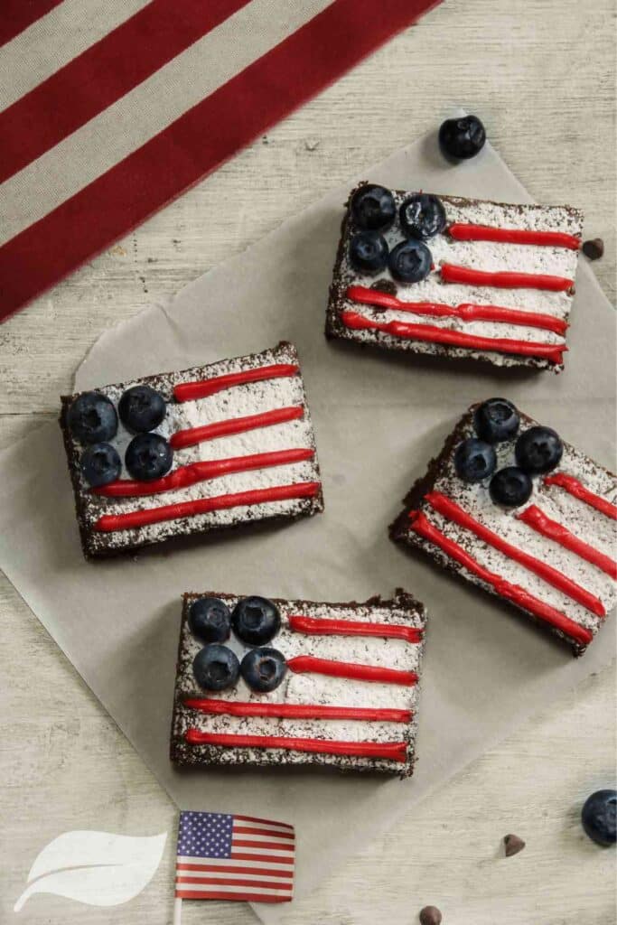 4 pieces of cake with the american flag on top made with fruit and jam
