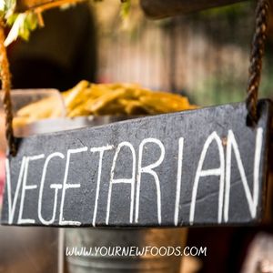 vegetarian sign on a slate sign hanging on some rope