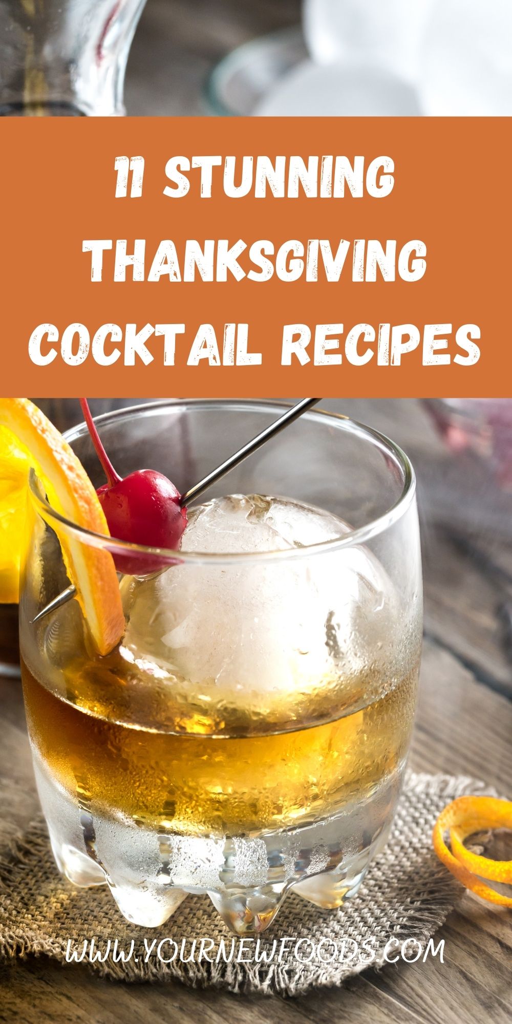 Thanksgiving Cocktail in a glass with a large piece of ice and a slice of orange