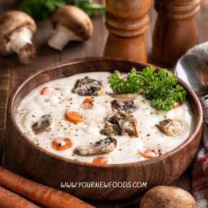 Creamy leftover thanksgiving turkey soup in a wooden bowl