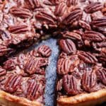 Pecan Pie with a slice cut and moved slightly out of the pie