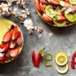 vegan fruit in bowls with vegan spelt out using fruit pieces