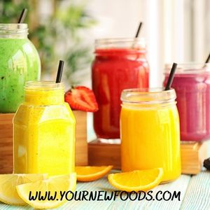 5 smoothies in mason jars. Smoothie colours are green, red and yellow