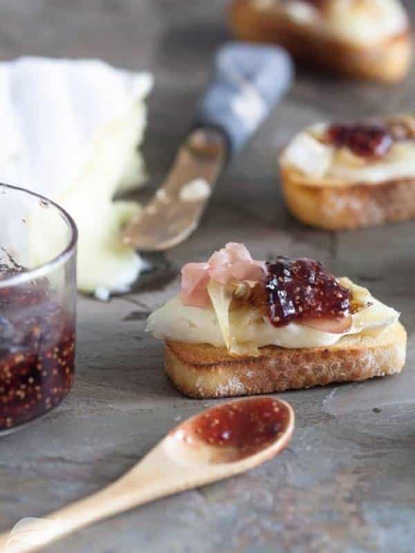 Brie With Caramelized Onions, Prosciutto, And Fig Jam