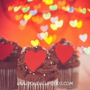 3 Valentines day chocolate cupcakes with a red heart on top