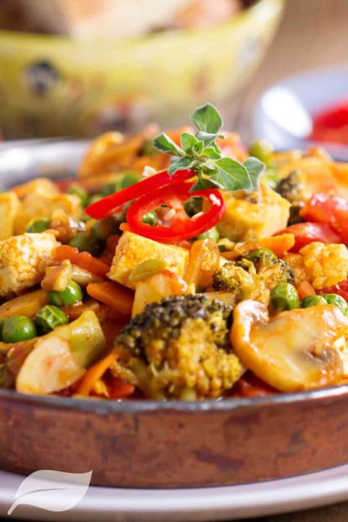 Vegan curry with tofu, broccoli, peas, and chilli