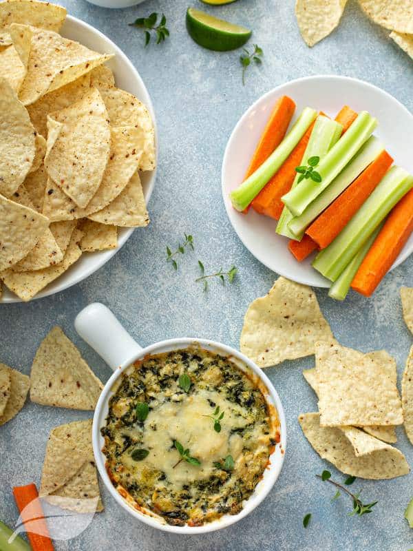 Spinach Artichoke Dip with carrot and celery sticks