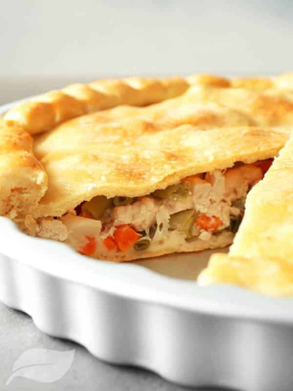 Turkey pot pie in a white casserole dish
