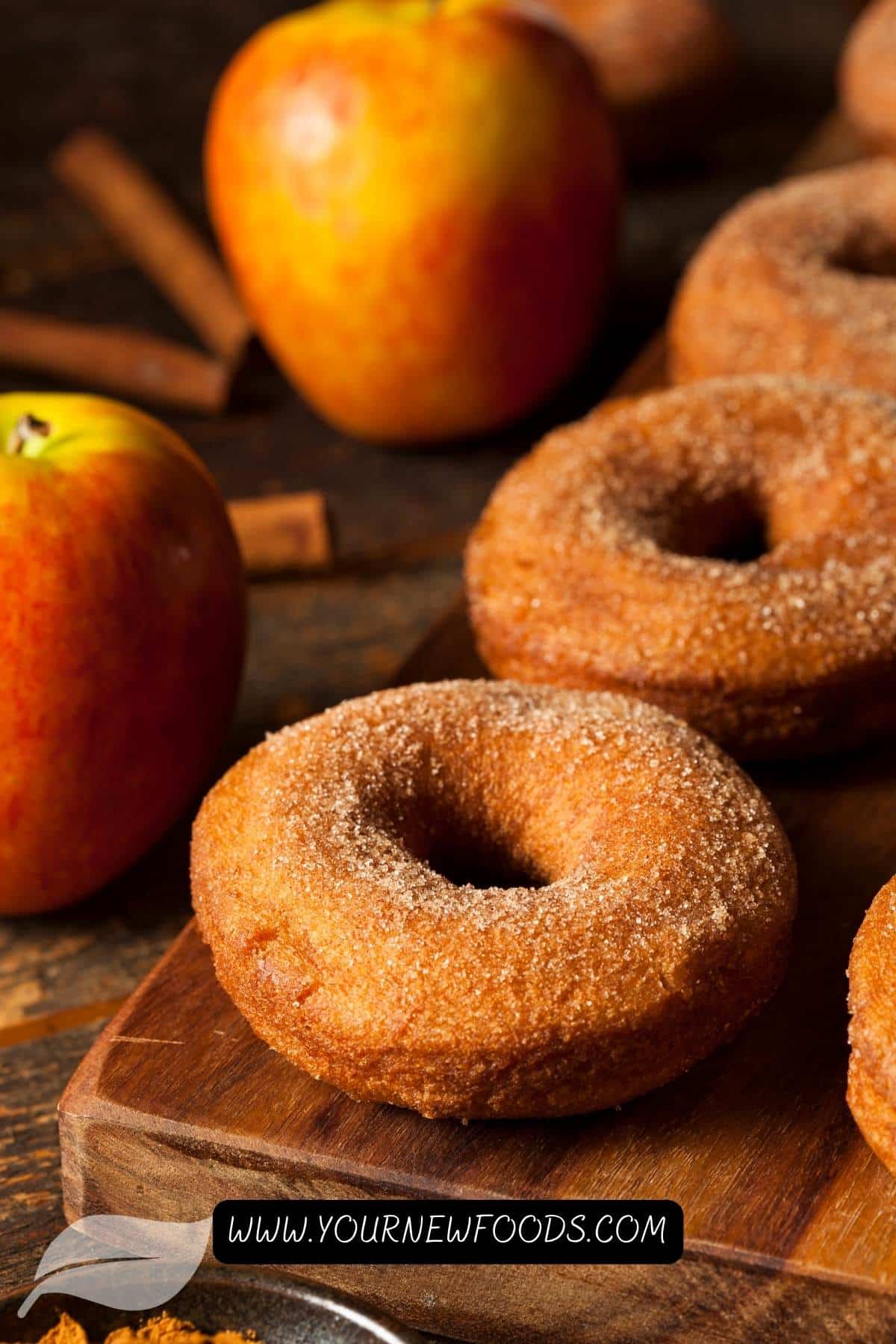 Homemade apple cider donuts on a wooden board