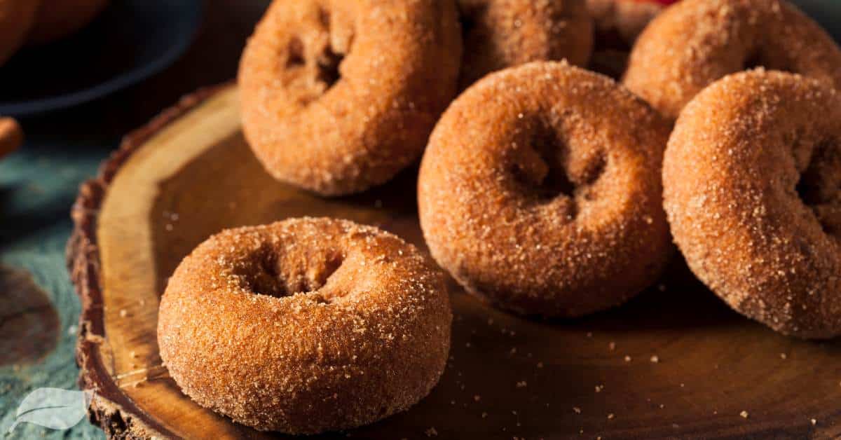 Homemade apple cider donuts on a wooden board