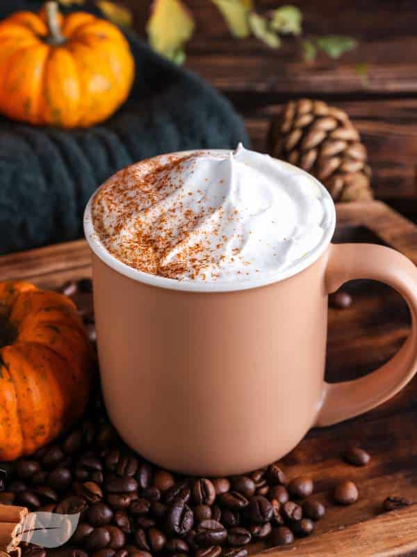 Pumpkin Spice latte in a mug with cream