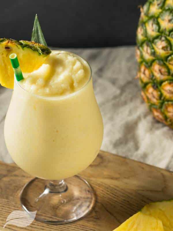 pina colada with pineapple 'on a wooden board