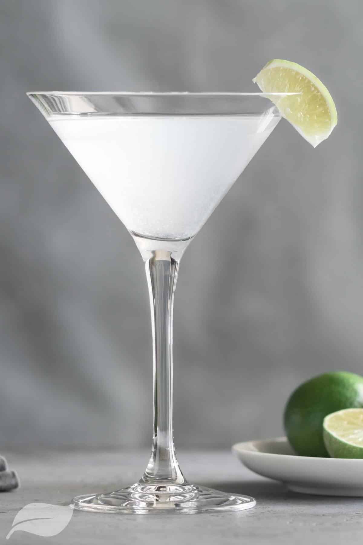 Kamikaze cocktail with limes on a plate