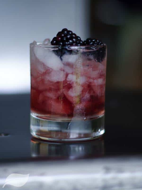 bramble cocktail with blackberries on top