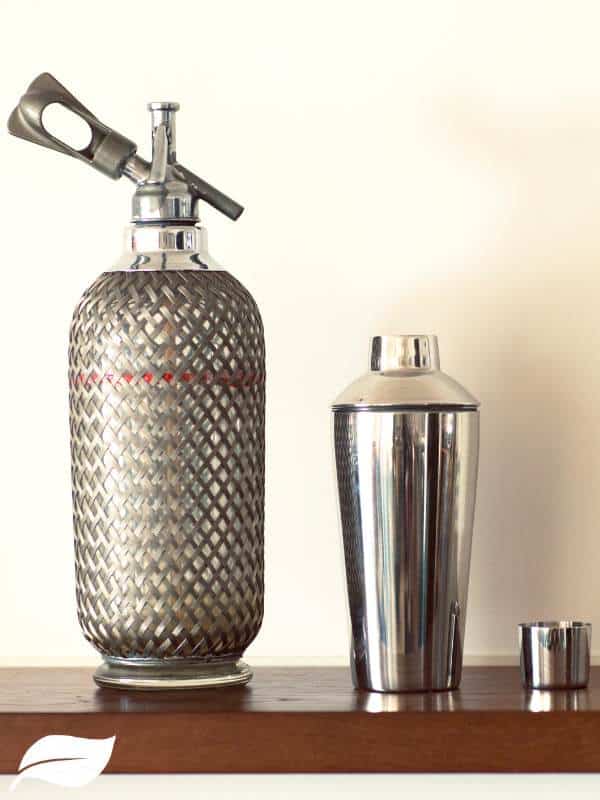 soda watwer in a dispenser and a cocktail shaker