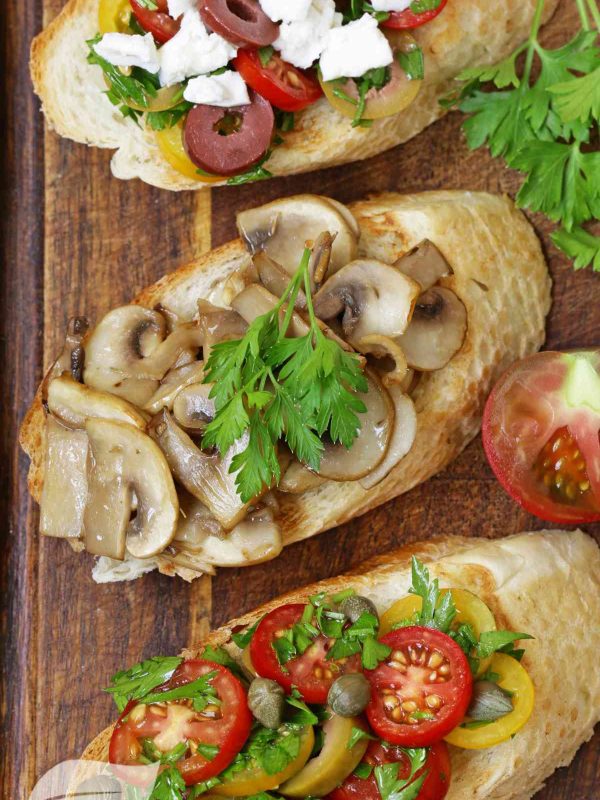 Bruschetta with mushrooms, tomatoes and olives